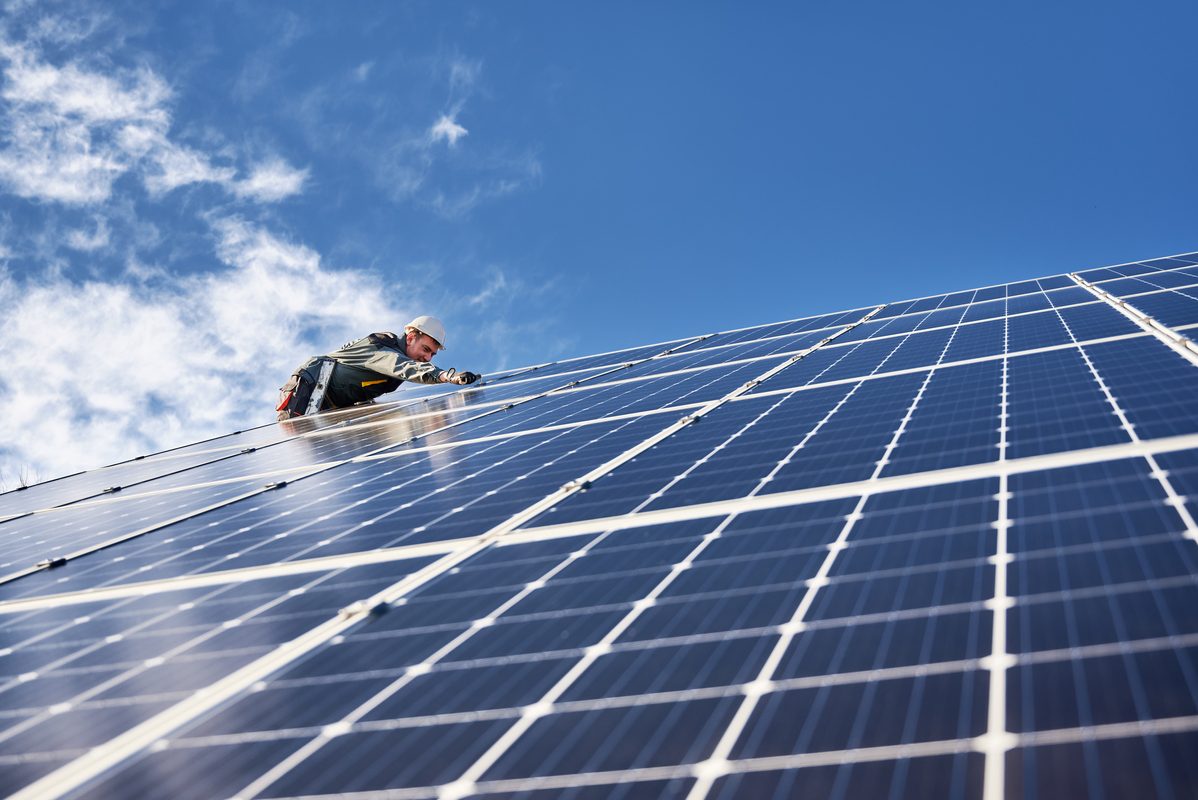 Electrician installing solar panel Electrician installing solar panel